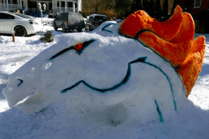 A Broncos snow horse made with orange and blue food coloring